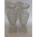 A good pair of tall cut glass vases on square base
