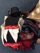 A suitcase containing silk shawl, fancy dress outf