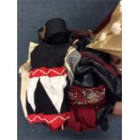 A suitcase containing silk shawl, fancy dress outf