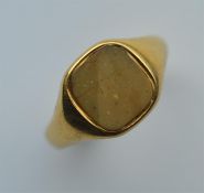 An 18 carat gent's signet ring inset with hard sto