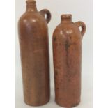 Two stoneware water bottles with textured handles.