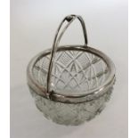 A silver mounted and cut glass sugar bowl with bal