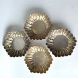 A good set of four bonbon dishes with crimped rims
