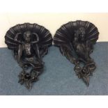 An impressive pair of large carved brackets mounte