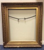 A large gilt frame. Approx. 64 cms x 72 cms. Est.