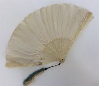 A good carved ivory fan with feather mounts. Est.