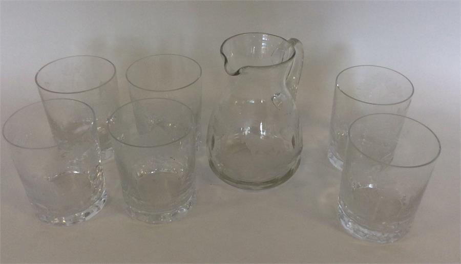 A attractively etched lemonade set decorated with