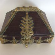 An unusual brass mounted and domed top tea caddy w