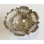 A circular embossed sweet dish attractively decora