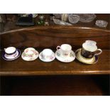 Decorative miniature cabinet cups and saucers.