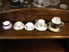 Decorative miniature cabinet cups and saucers.