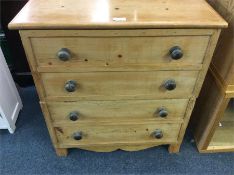 A pine hinged top commode.