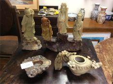 Soapstone carvings of Buddhas.