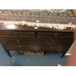 A mahogany chest of five drawers.