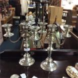 A pair of plated candelabra.