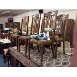 A set of six oak dining chairs.