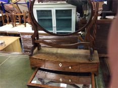 A mahogany toilet mirror together with one other.