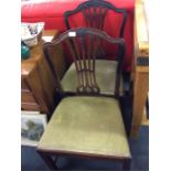 A pair of Georgian dining chairs with slip in seat