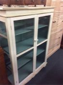 A white painted display cabinet.