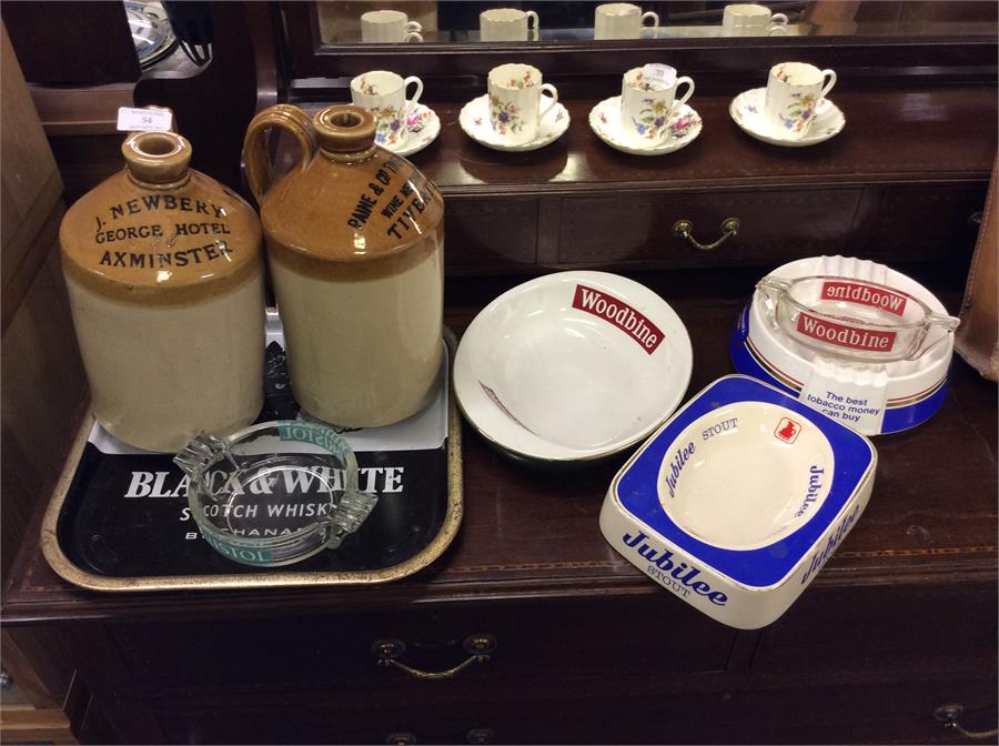 Advertising ashtrays together with stoneware bottl