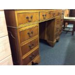 An elm twin pedestal writing desk.