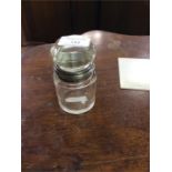 A silver mounted dressing table bottle with lift o