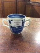 An Antique blue and white cup.