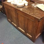 An Antique oak coffer.