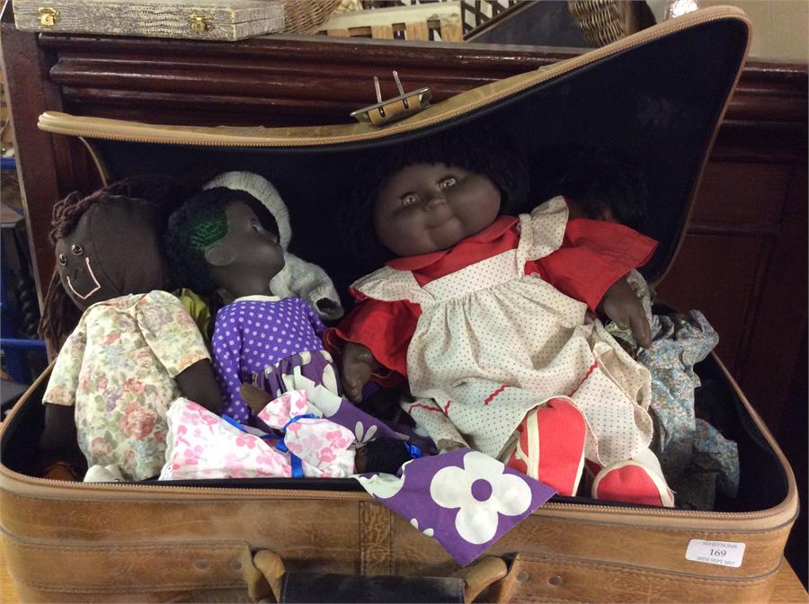 A collection of black dolls.