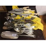 A large collection of plated cutlery.