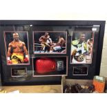 An Evander Holyfield boxing glove in boxed frame,