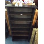 An oak six tier bookcase.