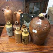 A collection of stoneware bottles.
