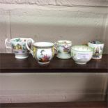 Six decorative cabinet cups.