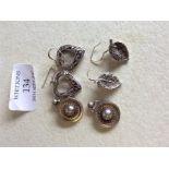 A pair of late Victorian silver earrings together