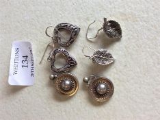 A pair of late Victorian silver earrings together