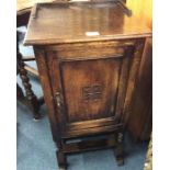 An oak pot cupboard retailed by Kean and Scott of