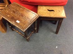 A coffin stool together with one other.