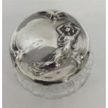 A stylish silver topped jar in the form of a lady