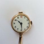 A lady's 9 carat wristwatch with white enamel dial