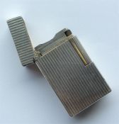 DUPONT: A reeded lighter with hinged top. Est. £30