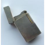 DUPONT: A reeded lighter with hinged top. Est. £30