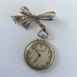 A lady's gold and pearl mounted nurse's watch with