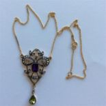 A large amethyst and peridot drop pendant on fine