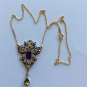 A large amethyst and peridot drop pendant on fine