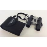 NIKON: A pair of sport lite 10 x 25 binoculars. Es