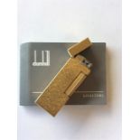 DUNHILL: A boxed gold plated lighter complete with