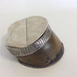 An unusual inkwell in the form of a horse's hoof w