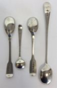 A collection of various cruet spoons together with