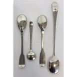 A collection of various cruet spoons together with